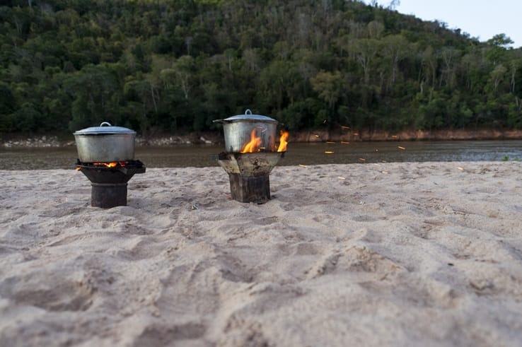 pots on fire near river