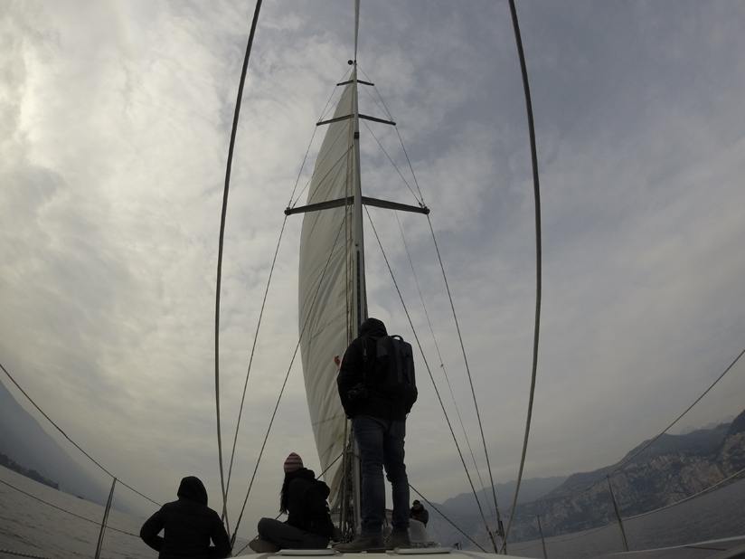 lake garda sailboat clouds