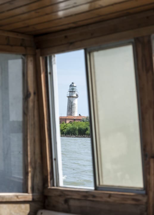 lighthouse through boat window