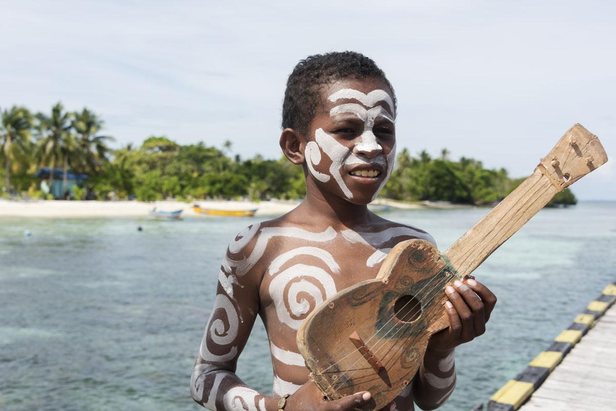 arborek-village-raja-ampat-boy-guitar