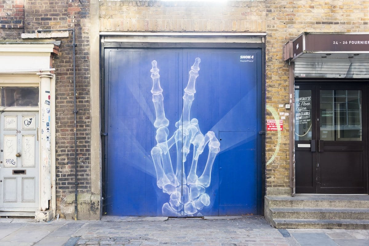 shoreditch street art skeleton hand