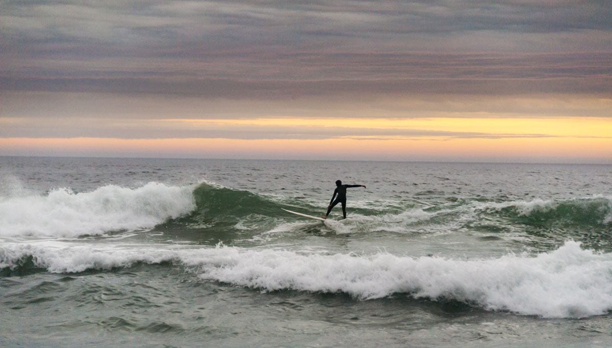 cape peninsula surfer sunset