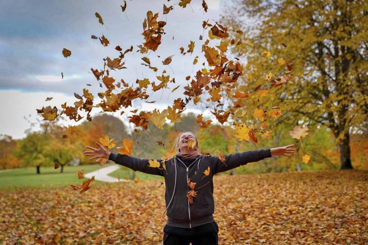 latvia autumn throwing leaves